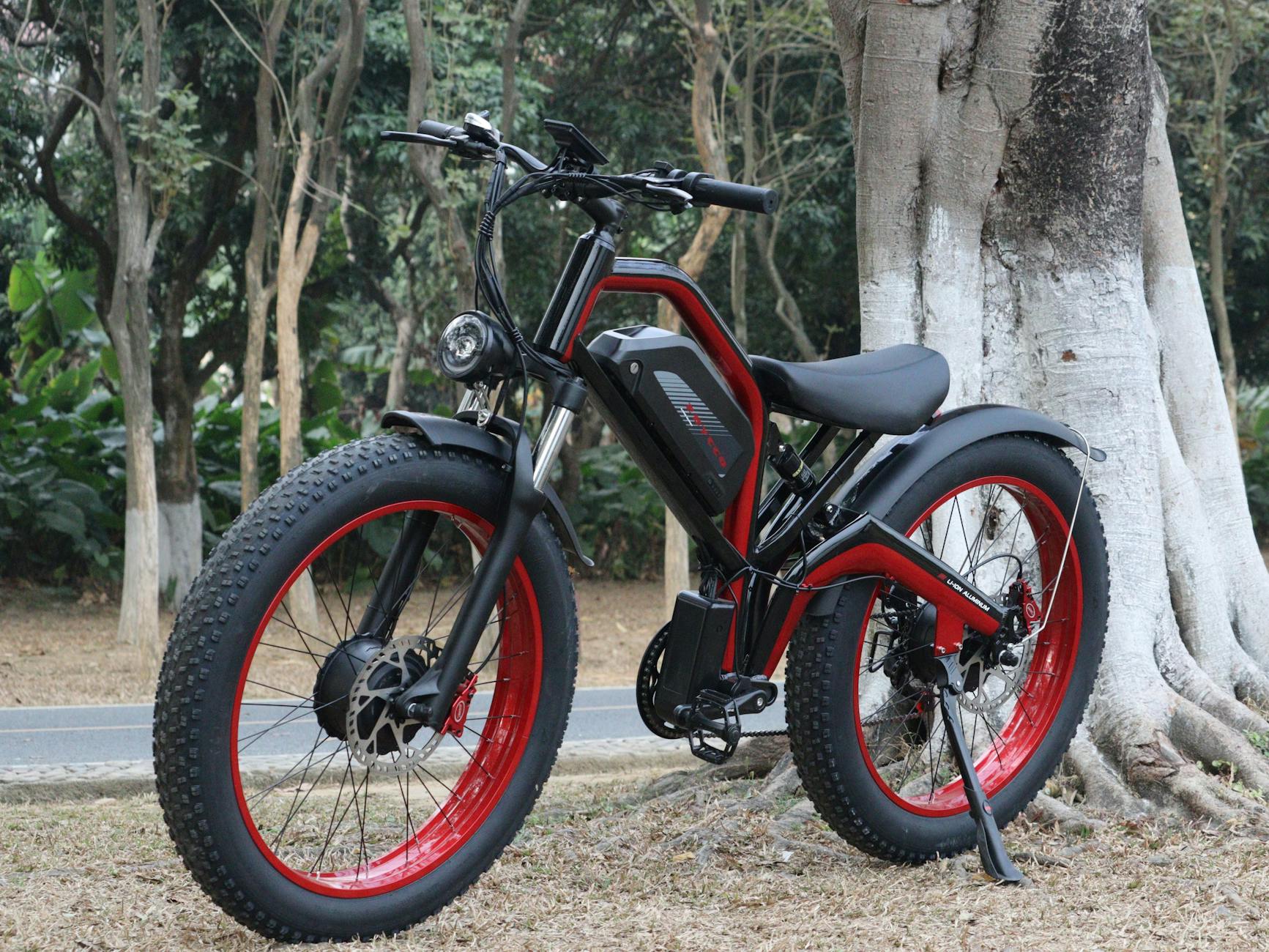 A stylish electric bike parked near a tree in an outdoor woodland area, perfect for adventure enthusiasts.